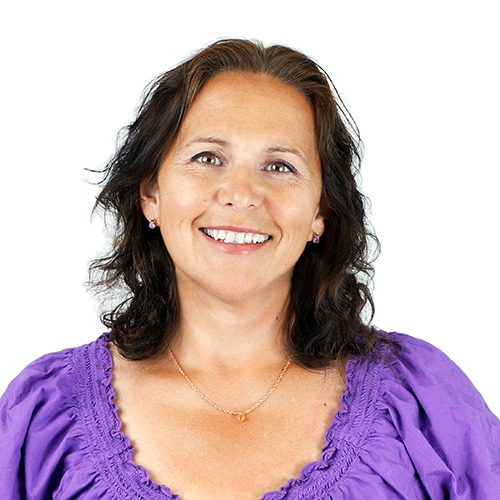 Sign language services client smiling wearing a blue shirt